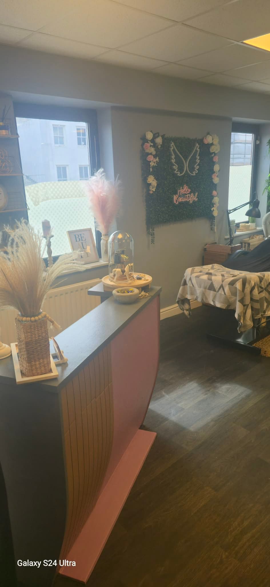 Reception desk and treatment area inside the doubleabeauty salon