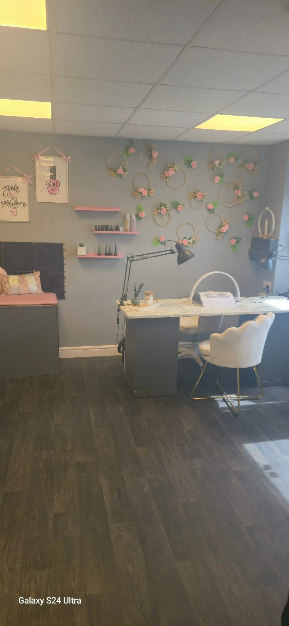 Wide view of the salon nail station and manicure seating